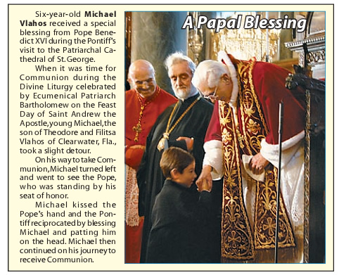 Orthodox boy kisses the Pope's hand prior to receiving Holy Communion